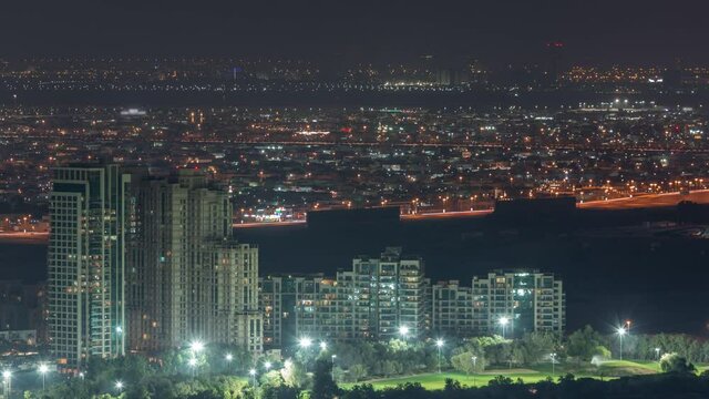 Aerial view of greens district area night timelapse from Dubai marina.