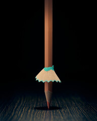 Pencil under a theatrical light with a chip skirt