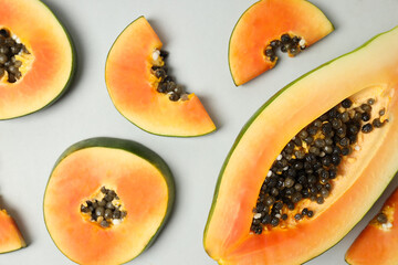 Flat lay with papaya on light gray background