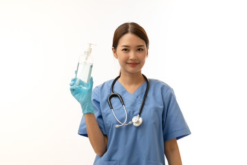 young female Asian doctor smile face wearing blue scrubs and Gloves showing alcohol gel pump...