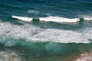 Aerial view of a wild beach and blue water with ocean waves in South Africa. Concept of travel,...
