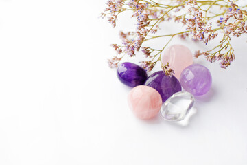Beautiful amethyst crystals and round rose quartz stone with dry lavender bouquet. Magic amulets....