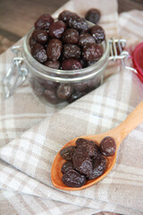 black round buttery olives with a stone