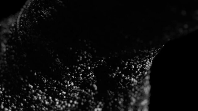 plastic thar splash on black background 4k footage