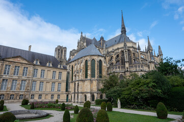 Fototapeta na wymiar View from back side on gothic Roman Catholic cathedral church Notre-Dame in central part of old French city Reims, France