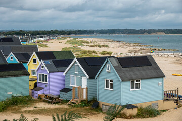 colourful beach huts at Mudeford Spit Hampshire England