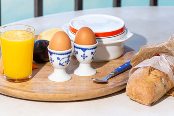 Continental breakfast with soft-boiled chicken egg served outdoor
