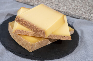 Cheese collection, hard French cheese comte made from  cow milk with rind in Franche-Comte region, France