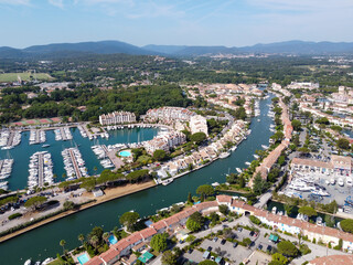 Obraz premium Aerial view on small houses and sailboats of Port Grimaud and port Cogolin, French Riviera, Provence, France