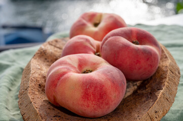 Fresh ripe flat peaches Prunus persica or doughnut peach or Saturn peach
