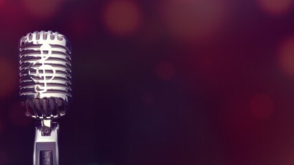 Retro microphone for recording and performing for singers on stage. Bokeh light background can put advertising text.