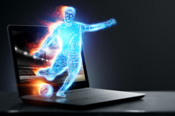A hologram of a soccer player running out of a notebook, laptop screen. The concept of sports betting, football, gambling, online broadcast of football.