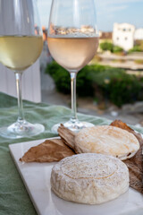 Cheese collection, semi-hard French blue cheese roquefort from Roquefort-sur-Soulzon, France served with sweet cold white french wine