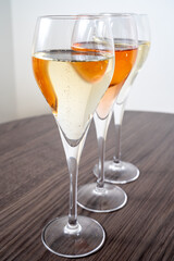 Tasting of white and rose champagne sparkling wine from flute glasses