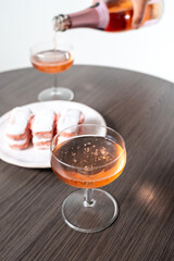 Symbols of Reims - glasses of rose brut champagne and rose biscuits