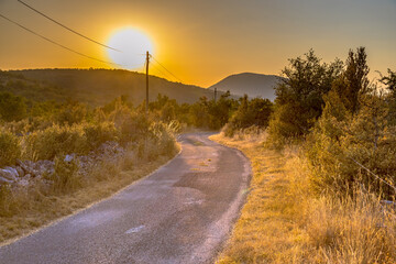 Sunrise over road in Causse Blandas