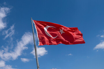 Turkish flag against blue sky