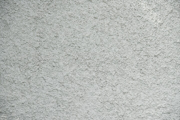 close-up grunge gray concrete wall texture background, cement walls are decorated with plastering techniques to have rough surface like cement dripping for decoration exterior facade building wall