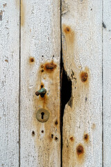 Wood texture, background, rusty, cracks in the painted white door.