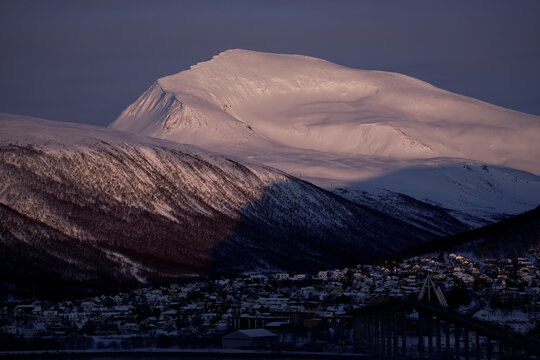 Sunset on a snowy Tromsdalstinden near Tromsø