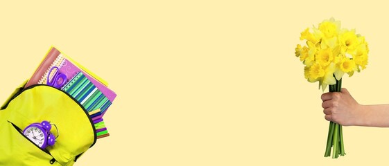 Back to school concept. Backpack with school supplies and bouquet.