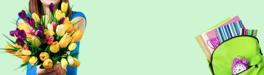 Back to school concept. Backpack with school supplies and bouquet.