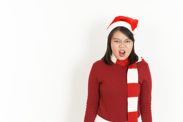 Angry Gesture Face Expression of Beautiful Asian Woman Wearing Red Turtleneck and Santa Hat Isolated On White Background