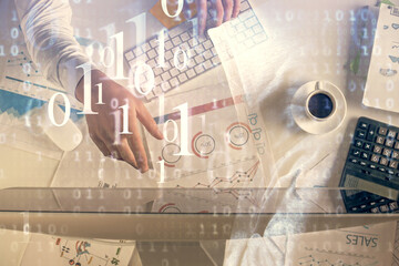 Double exposure of man's hands typing over computer keyboard and data theme hologram drawing. Top view. Technology concept.