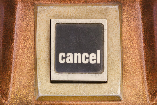 Retro styled image of a cancel button on a vintage arcade game machine