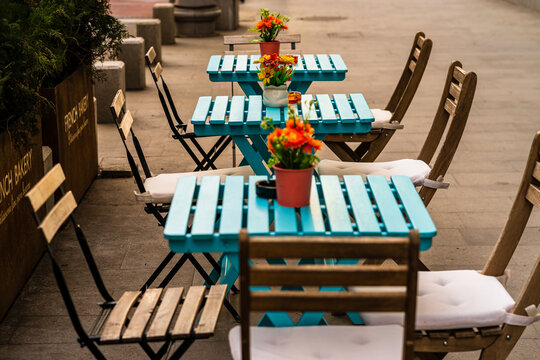 Empty Tables With Empty Chairs At A Local Outdoor Restaurant In Bucharest, Romania