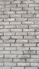 Background photo of a wall with neatly arranged white bricks