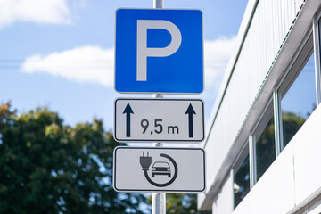 Electric car charging station at a parking lot