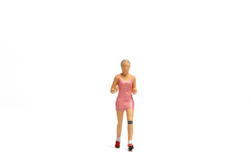 Miniature people, Woman in fitness wear running on white background