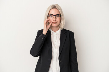 Young caucasian business woman isolated on white background with fingers on lips keeping a secret.