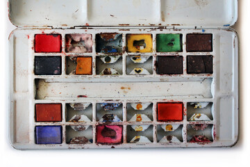 Plain view of used set of water color in metal paint box, close up. Concept for art and creativity