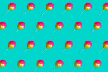 Colorful balloons on a pastel blue background