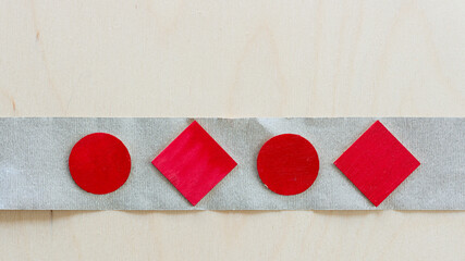 crepe paper ribbon with circles and diamonds on a wooden background