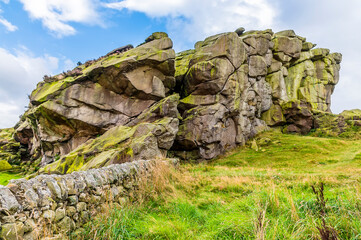 Fototapeta na wymiar A close up of the western summit of the Almscliffe crag in Yorkshire, UK in summertime
