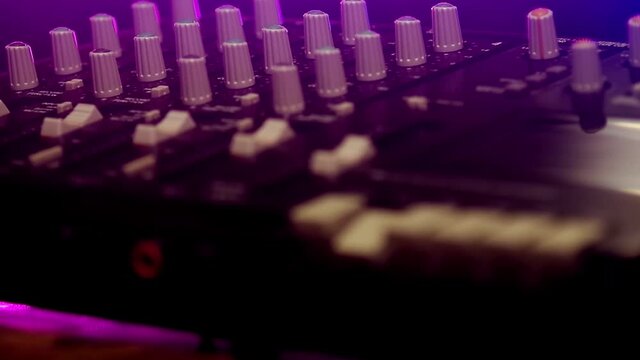 Lid closing and pressing play key. Portative cassette tape studio mixer closeup shot with bokeh.