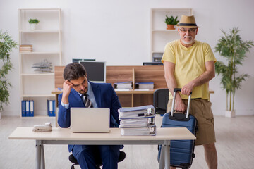 Old boss and young male employee in summer vacation concept