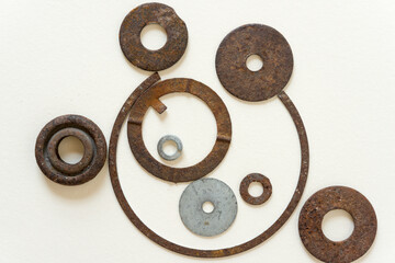 metal objects loosely arranged on a paper background