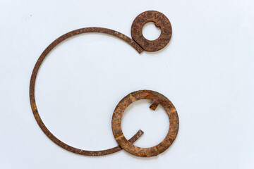 metal objects loosely arranged on a paper background