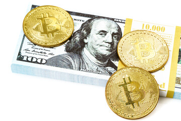 coins of bitcoin with heap of dollar bill on white. Business concept
