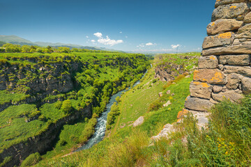 Old Armenian Lori Berd fortress wall and picturesque canyon and gorge carved into the rocks by Urut...