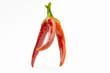Spicy red peppers close-up isolated on white background.