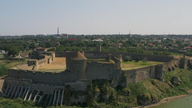 Belgorod-Dnestrovskaya fortress from a bird's eye view. The largest fortress in Ukraine is located on the Dniester River. Green blooming water and white-stone walls of the fortress.