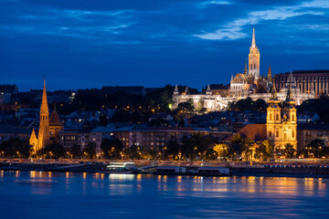 view on Fisherman Bastion and Matthias church at Danube river during dusk in Budapest, Hungary