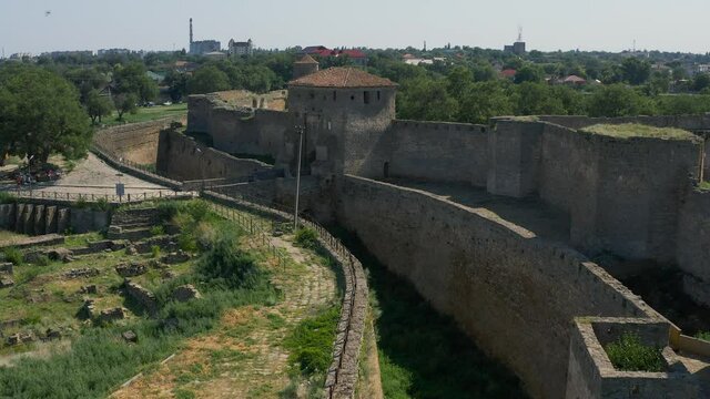 Belgorod-Dnestrovskaya fortress from a bird's eye view. The largest fortress in Ukraine is located on the Dniester River. Green blooming water and white-stone walls of the fortress.