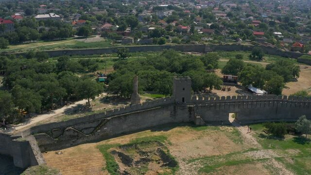 Belgorod-Dnestrovskaya fortress from a bird's eye view. The largest fortress in Ukraine is located on the Dniester River. Green blooming water and white-stone walls of the fortress.