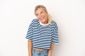 Obraz premium Young Russian woman isolated on white background laughs and closes eyes, feels relaxed and happy.